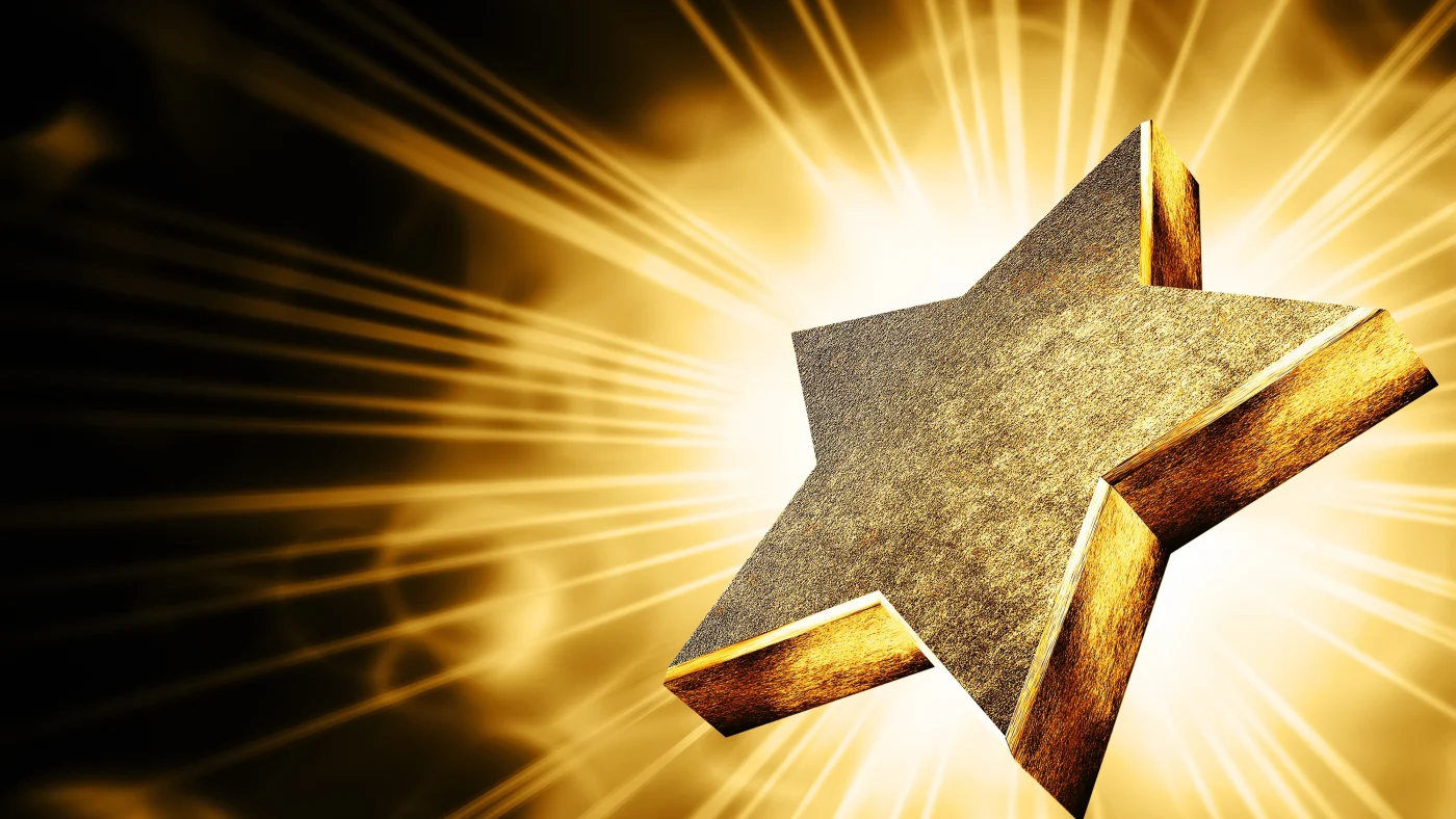 A brilliant gold star with gold flowing off it