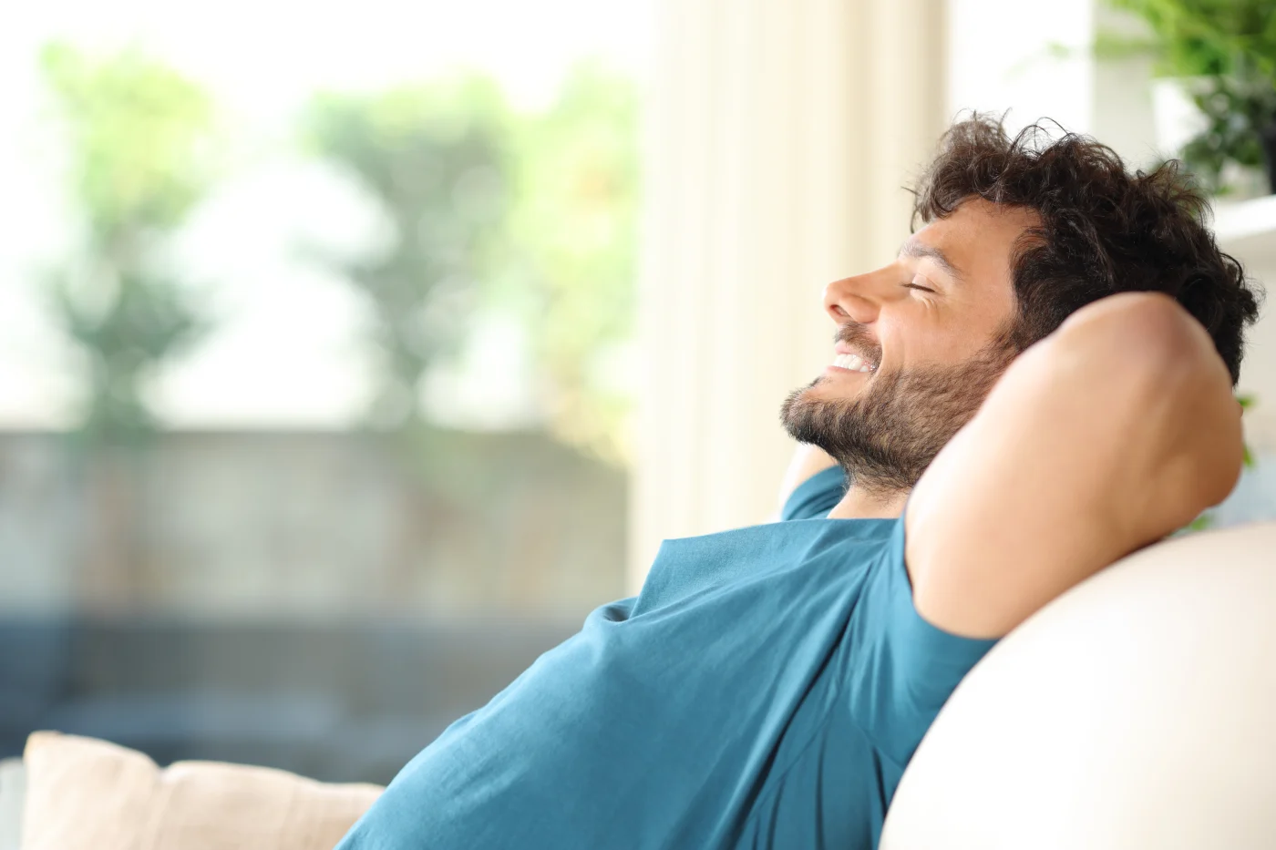 A homeowner sits in comfort in his house.